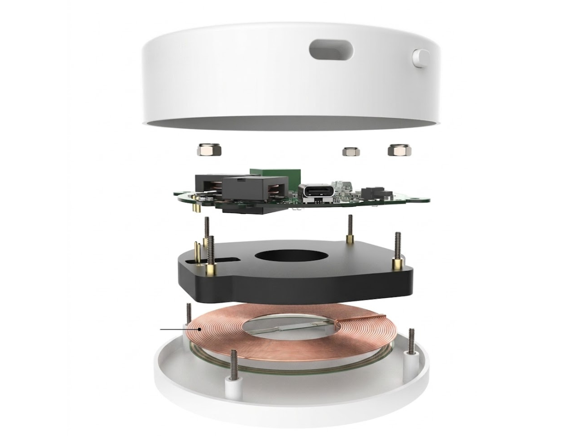 Exploded view of an implant wireless charging platform showing PCB, inductive coil, and enclosure